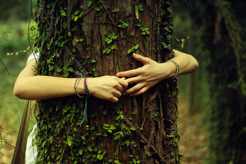 Woman hugging a tree